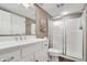 A bright bathroom featuring a white vanity, a glass-enclosed shower, and modern fixtures at 14027 Waterway Blvd, Fishers, IN 46040
