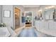 Beautiful bathroom featuring double vanities, soaking tub, glass shower, and neutral tile at 14027 Waterway Blvd, Fishers, IN 46040