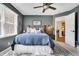 Bedroom features cool gray walls, a patterned rug and a coordinating blue bed spread at 14027 Waterway Blvd, Fishers, IN 46040