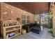 A relaxing covered patio featuring a comfortable seating area and a gardening station at 14027 Waterway Blvd, Fishers, IN 46040