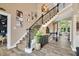 Elegant foyer with staircase, decorative accents, and hardwood floors at 14027 Waterway Blvd, Fishers, IN 46040