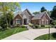 Charming brick home featuring a stone entryway and manicured landscaping at 14027 Waterway Blvd, Fishers, IN 46040
