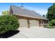 Spacious two-car garage with stylish brick exterior, well-maintained driveway, and mature landscaping enhancing curb appeal at 14027 Waterway Blvd, Fishers, IN 46040