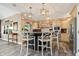 Kitchen with a center island, granite countertops, stainless steel appliances, and modern pendant lights at 14027 Waterway Blvd, Fishers, IN 46040