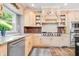 Bright kitchen featuring granite countertops, stainless steel appliances, and wood floors at 14027 Waterway Blvd, Fishers, IN 46040