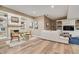 An inviting living area with a fireplace, built-in shelves, light wood flooring, and neutral decor at 14027 Waterway Blvd, Fishers, IN 46040
