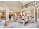 Open concept living room with a modern kitchen and a comfortable leather couch at 14027 Waterway Blvd, Fishers, IN 46040