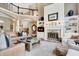 Living room with a fireplace, built-in shelving, and comfortable seating at 14027 Waterway Blvd, Fishers, IN 46040
