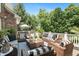 An expansive outdoor deck with stylish wicker seating and lush greenery, perfect for outdoor enjoyment at 14027 Waterway Blvd, Fishers, IN 46040