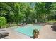 A refreshing swimming pool surrounded by lush greenery and lounge chairs, ideal for outdoor relaxation at 14027 Waterway Blvd, Fishers, IN 46040