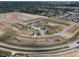 Aerial view of residential development featuring single-Gathering homes, curved streets and picturesque landscapes at 1436 Aster Dr, Shelbyville, IN 46176