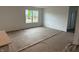 Spacious living room with neutral walls, offering a blank canvas for personal design and comfort at 1436 Aster Dr, Shelbyville, IN 46176