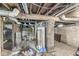 Exposed basement features brick support column, water heater and exposed piping at 2020 N B St, Elwood, IN 46036