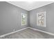 Carpeted bedroom featuring neutral walls and natural light streaming through the double windows at 2020 N B St, Elwood, IN 46036