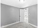 Carpeted bedroom featuring neutral walls and an open doorway to another room at 2020 N B St, Elwood, IN 46036