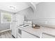Functional kitchen area with plenty of counter space, appliances, and a well-lit cooking area at 2020 N B St, Elwood, IN 46036