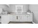 Bright kitchen features ample countertop space, updated cabinets, and a convenient sink at 2020 N B St, Elwood, IN 46036