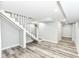 Basement staircase with painted steps and wood-look flooring at 2136 Ringgold Ave, Indianapolis, IN 46203
