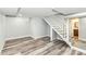 Basement staircase with finished steps and wood-look flooring at 2136 Ringgold Ave, Indianapolis, IN 46203