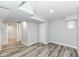 Finished basement with recessed lighting, gray walls and wood-look flooring at 2136 Ringgold Ave, Indianapolis, IN 46203