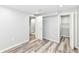 Basement area featuring wood-look floors, a closet, and access to the lower level of the home at 2136 Ringgold Ave, Indianapolis, IN 46203