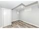 Finished basement area with gray walls and wood-look flooring; neutral and clean at 2136 Ringgold Ave, Indianapolis, IN 46203