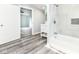 Bright bathroom with modern shower/tub combo and white vanity at 2136 Ringgold Ave, Indianapolis, IN 46203