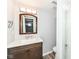 Modern bathroom featuring a wood vanity, a large mirror, and a glass enclosed shower at 2136 Ringgold Ave, Indianapolis, IN 46203