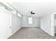 Neutral bedroom boasts a modern ceiling fan and natural light at 2136 Ringgold Ave, Indianapolis, IN 46203