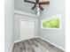 Bedroom with high ceilings, closet, and ample natural light, featuring updated wood-look floors at 2136 Ringgold Ave, Indianapolis, IN 46203