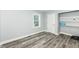This bedroom features wood-look flooring, a window, and a closet for storage at 2136 Ringgold Ave, Indianapolis, IN 46203