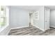 Cozy bedroom with fresh paint, modern flooring, and trim, lit by natural light from the windows at 2136 Ringgold Ave, Indianapolis, IN 46203