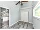 Bright bedroom boasts vaulted ceiling, ceiling fan, closet and wood-look floors at 2136 Ringgold Ave, Indianapolis, IN 46203