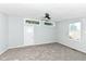 Neutral bedroom boasts a modern ceiling fan and natural light at 2136 Ringgold Ave, Indianapolis, IN 46203