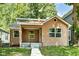 Charming single-story home with well-kept landscaping and a welcoming front porch at 2136 Ringgold Ave, Indianapolis, IN 46203