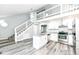 Updated kitchen features granite countertops, stainless appliances, and open concept design at 2136 Ringgold Ave, Indianapolis, IN 46203