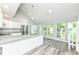 Sunlit kitchen with stainless steel appliances, granite countertops, and a view to the backyard at 2136 Ringgold Ave, Indianapolis, IN 46203