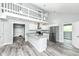 Open concept kitchen featuring white cabinetry, granite countertops, and stainless steel appliances at 2136 Ringgold Ave, Indianapolis, IN 46203