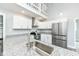 Modern kitchen with stainless steel appliances, granite countertops, and updated fixtures at 2136 Ringgold Ave, Indianapolis, IN 46203