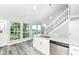 Bright, updated kitchen with granite countertops, stainless steel dishwasher, and backyard view at 2136 Ringgold Ave, Indianapolis, IN 46203