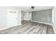 Inviting living room features new flooring, a ceiling fan, and a stylish accent wall at 2136 Ringgold Ave, Indianapolis, IN 46203