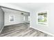 Open living room features modern flooring, neutral paint, and large windows for ample natural light at 2136 Ringgold Ave, Indianapolis, IN 46203