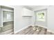 Utility room has new flooring, and fresh paint, lit by natural light from the window at 2136 Ringgold Ave, Indianapolis, IN 46203