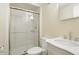 Bathroom with a tiled shower and floor, a toilet, and a vanity with sink and stainless steel fixtures at 2227 Hidden Orchard Ct, Indianapolis, IN 46228