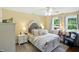 Well-lit bedroom showcasing a beautifully styled bed, complemented by a serene color palette at 2227 Hidden Orchard Ct, Indianapolis, IN 46228