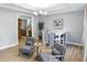 This dining area features two sitting areas and a view into the kitchen with modern appliances and fixtures at 2227 Hidden Orchard Ct, Indianapolis, IN 46228