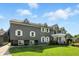 Side of two-story home with well-manicured lawn and bright green landscape at 2227 Hidden Orchard Ct, Indianapolis, IN 46228