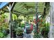 Cozy gazebo interior with comfortable seating, a ceiling fan, and string lights for a relaxing atmosphere at 2227 Hidden Orchard Ct, Indianapolis, IN 46228