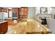 Spacious kitchen featuring beautiful granite countertops that extend to the living area fireplace at 2227 Hidden Orchard Ct, Indianapolis, IN 46228