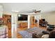 Spacious living room with hardwood floors, a ceiling fan, and comfortable seating with cup holders at 2227 Hidden Orchard Ct, Indianapolis, IN 46228